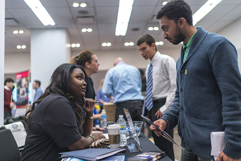 A student interviews with a recruiter from Crestron Electronics Inc.