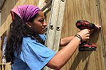 NYIT students hard at work reinforcing roofs, doing light framing, and installing hurricane clips for new homes for displaced families in Puerto Rico.