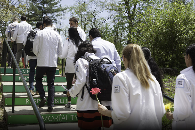 Students line up along the steps the Healing Path to honor donors.