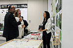 NYIT student Hannah Mapoy (right) explains her project to Deans Sheldon Fields and Maria Perbellini.