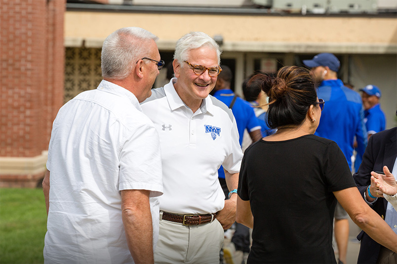 NYIT President Hank Foley, Ph.D., greets attendees.