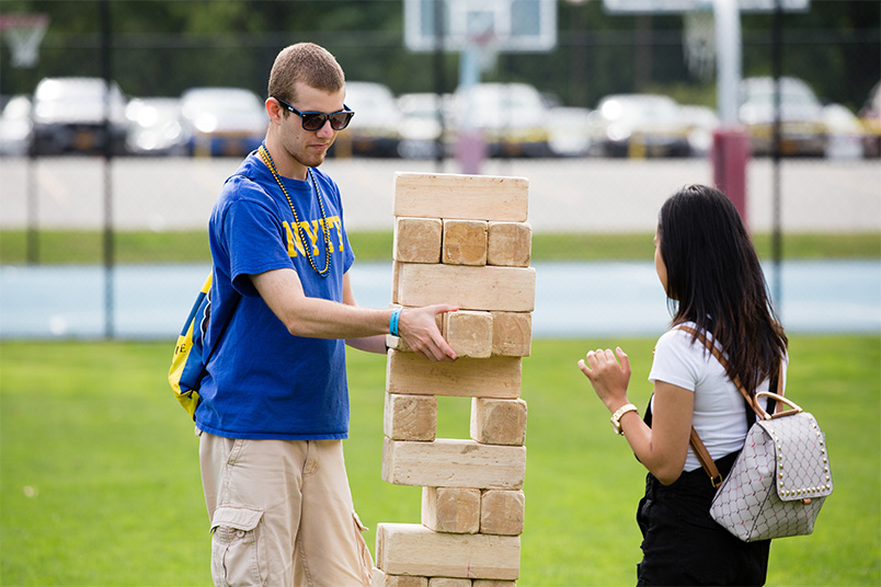 NYIT students play Jenga.