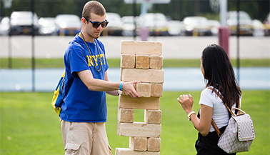 NYIT students play Jenga.