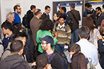 Cyber security conference participants view research posters.