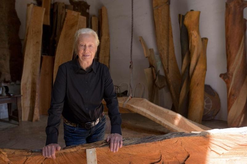 Artist Emilie Brzezinski standing in her studio